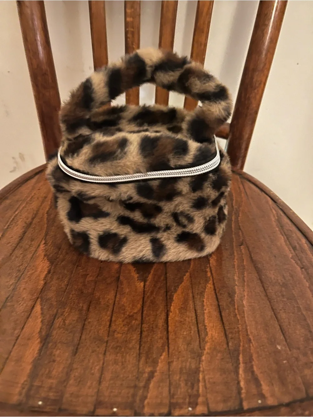 Urban Outfitters plush leopard cosmetic bag